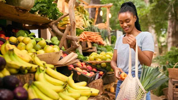 young woman shopping for fruits